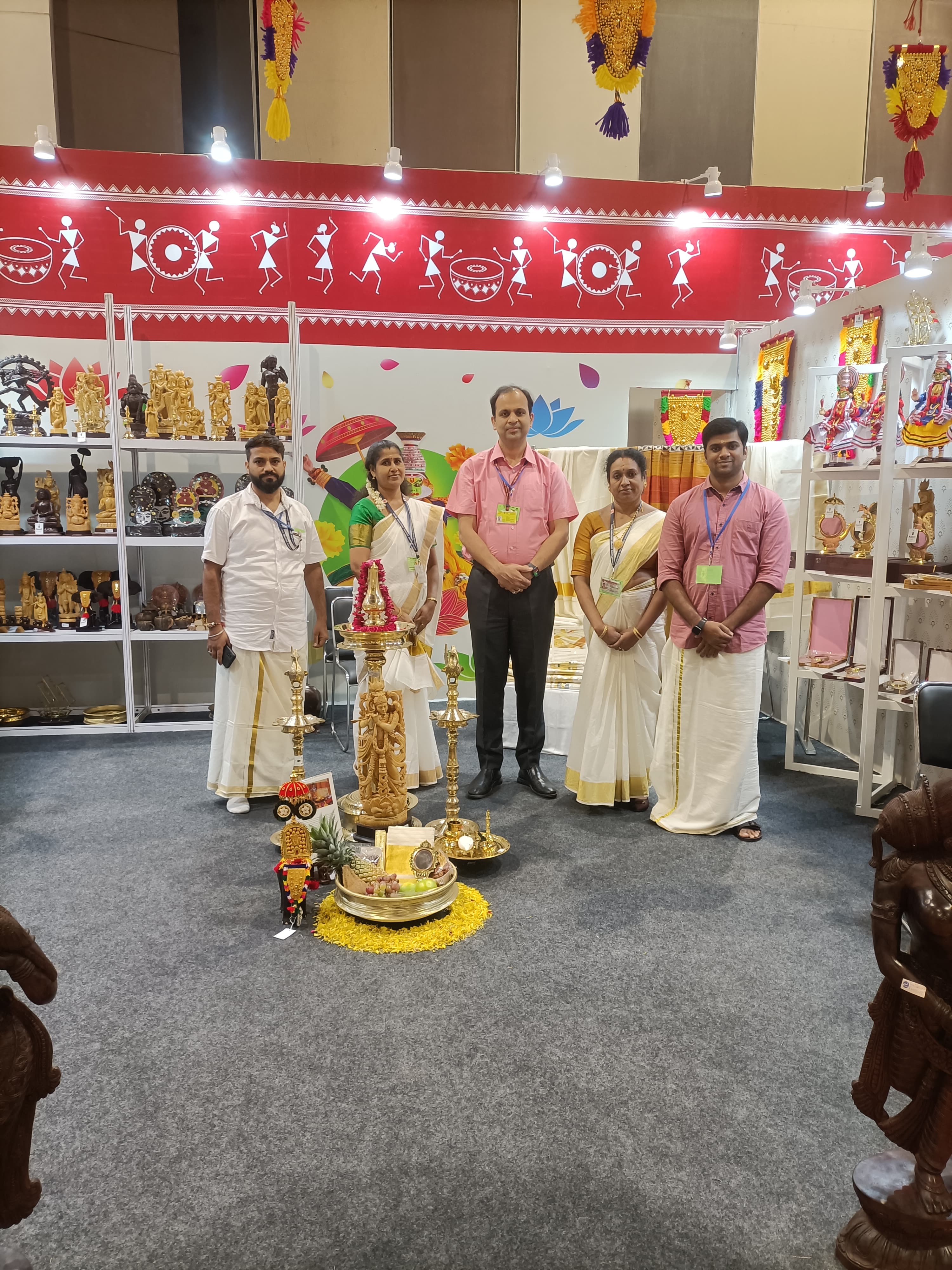 Resident Commissioner Shri. Saurabh Jain with staffs of Kairali Emporium in Delhi at G20 Kerala Pavilion.